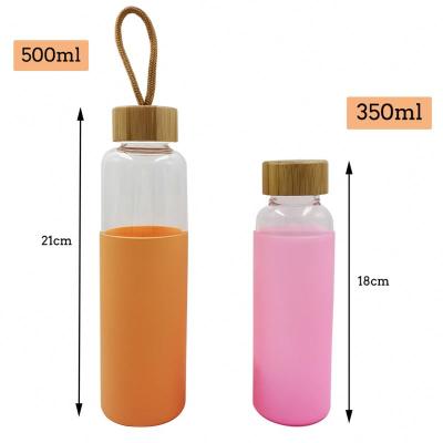 China 2021 Hot Sale Sustainable Price 500Mlcoloured Reasonable Glass Water Bottle With Bamboo Lids for sale