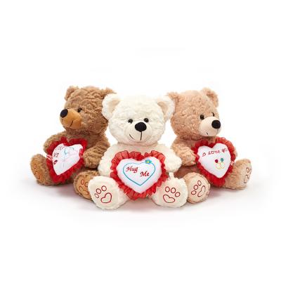 China Cute Three Color Cheap Doll Factory Custom Holding Teddy Bear With Heart Plush Toy for sale