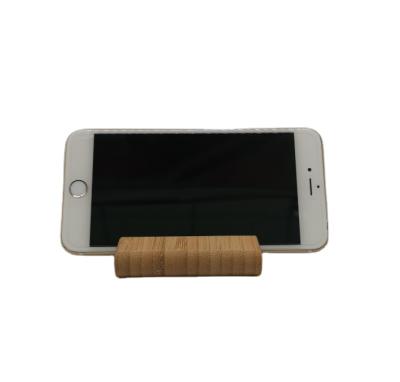 China PORTABLE Custom Bamboo Cell Phone Holder Laser Logo Bamboo Cell Phone Holders Mini Smart Phone Holder Wood for sale