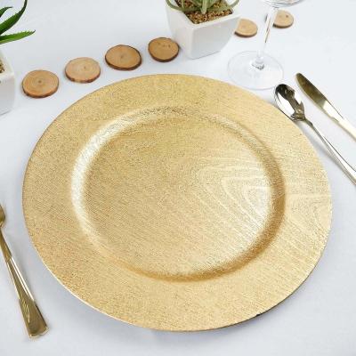 China Disposable Wedding Anniversary 13in Gold Wooden Textured Round Plastic Charger Plates for Dining Serving Reception Table Dinner for sale