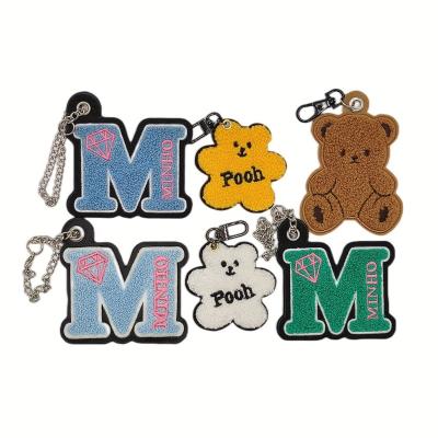 China Hot Selling 2022 Bear Letter Pattern Bag Key Chain Cute Creative Custom Cute Plush Toy Creative Hot Sale Plastic Key Chain for sale