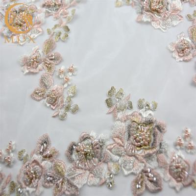 China Handmade high quality luxury lace fabric beaded bridal pearl lace 3D embroidery lace fabric on sale for sale