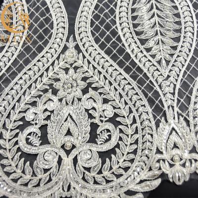 China Latest Handmade White Elegant Heavy Bead Lace Fabric BY The Yard 3D Beaded Embroidered Bridal Fabric On Mesh Lace for sale