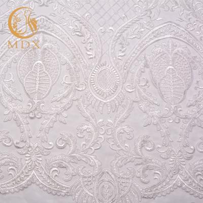 China Viable High Quality Designs Luxury Wedding Dress Bridal Gown Glitter Hand Embroidery Fabric for sale