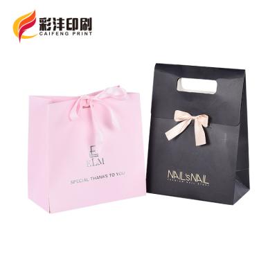 China Uniquecolour Disposable Custom Printing Commercial Luxury Shopping Gift Paper Bag for sale