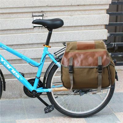 China Multifunctional Canvas Mountain Bike Canvas Riding Bag Travel Equipment Bicycle Shelf Bag Outdoor Activities Bike Backpack for sale