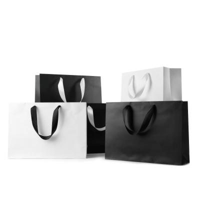 China Recyclable Laminated Printed Luxury Shopping Custom Paper Gift Bag With Your Own Logo for sale