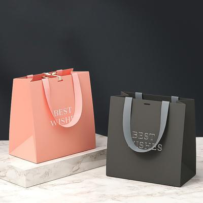 China Printed Cardboard Paper Bag Recyclable White Shopping Bag With LOGO Creative Packing Gift Packing Bag for sale