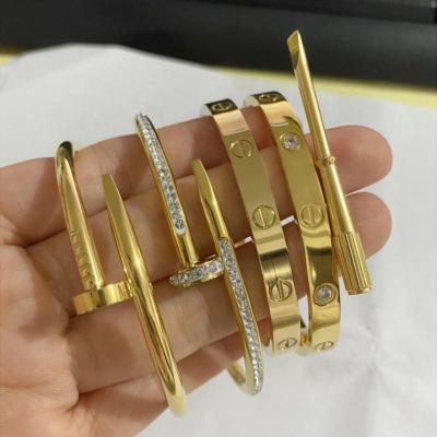 China Fashion Gold Plated Trendy New Skyline Designer Open Screw Bangles Stainless Steel Women Nail Bangle Bracelet for sale