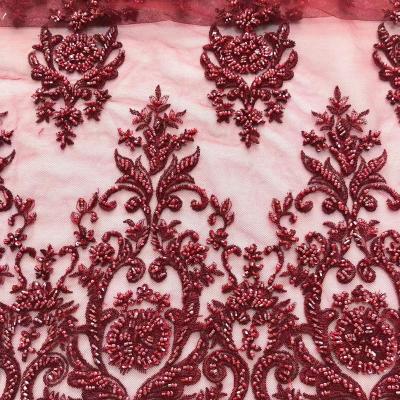 China Handmade Ready Goods Luxury Red Beaded Lace Fabric With Heavy Sequins 100 Polyester Beaded Fabric For Dress for sale