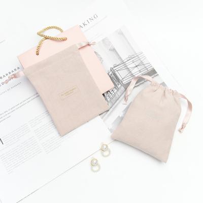 China Custom Logo Cotton Flannel Cosmetic Pouch Drawstring Security Cotton Flannel Makeup Cosmetic Bag Packaging for sale