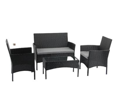 China Durable outdoor four-piece rattan sofa woven garden sofa combination rattan table and chair tea table combination balcony table and chair for sale