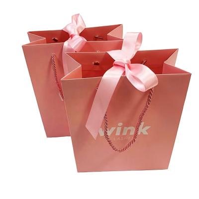 China Small Recyclable Recycled Lovely Pink Printed Gift Packaging Promotional Paper Bag With Ribbon Bow for sale