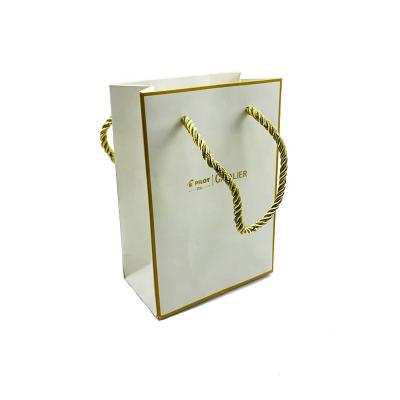 China Recyclable Custom Stamp Logo Luxury Gold Jewelry Paper Gift Handle Bag With Gold Rope Handle for sale