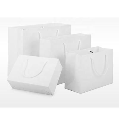 China Recycled Materials Logo Matte White Clothing Shopping Paper Custom Bags Shoes Hats Handbag Packaging Tote Bags for sale