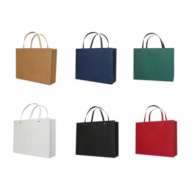 China High Quality Custom Recycled Materials Packaging Paper Shoes Clothing Shopping Bag The Clothing Shoes Paper Bags Carrier Bag for sale