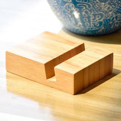 China Natural Handmade Wooden Bamboo Cell Phone Stand Holder Universal Phone Dock Station Holder for iPhone for sale