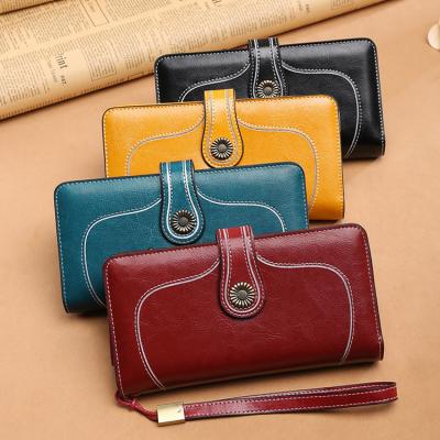 China RFID Anti Theft Bag Oil Wax Leather Large Capacity Ladies Hand Purse RFID Wallet for sale