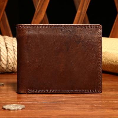 China 2021 Hot Sales RFID Waterproof Men's Wallet RFID Short Layer Cowhide Vintage Leather Anti - Magnetic First Bag for sale