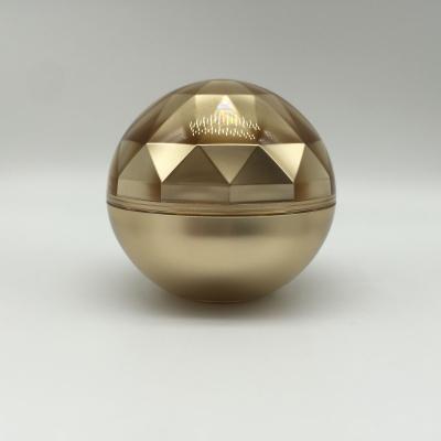 China Non Spill Luxury High Matt Gold Rhombus Ball Shape Round Acrylic Cream Jar For Cosmetic Packaging for sale