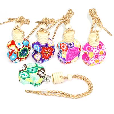 China Polymer Clay Cosmetic Hanging Decoration 12ml Car Perfume Bottle With Wooden Cap for sale