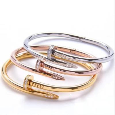 China Brand Charm 18k Gold Plated Men's And Women's Brand Style Fashion 316l Stainless Steel Nail Bracelet for sale