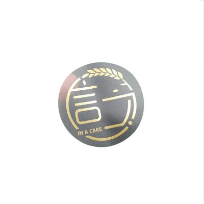 China Scratch Off Brand Custom Self Adhesive Die Cutting Transparent Logo Printing Gold Foil Hot Stamping Sticker For Bottle Packaging for sale