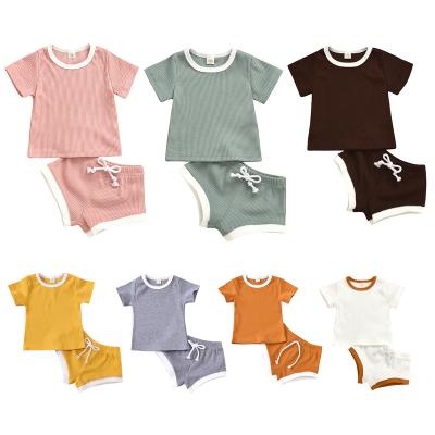 China 2020 Hot Selling Solid Color Mine Band Pure Fabric 9 Colors Optional Short Sleeve Top And Shorts Two Piece Suit For Boys And Girls for sale