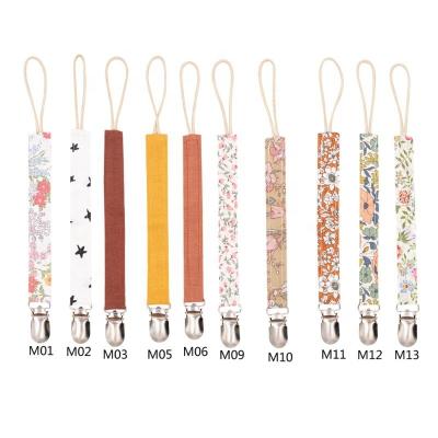 China Free Custom Printing Dummy Clip Latex Nipple Belt Soother Pacifier Holder Metal Clip Cotton Baby Pacifier Clip for sale