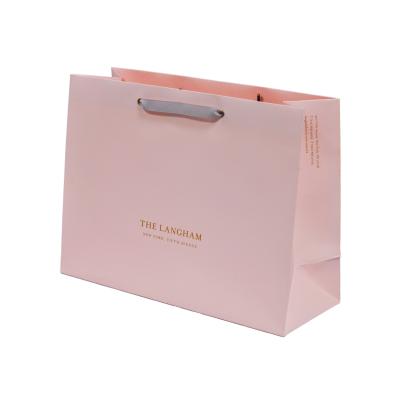 China Customized Wholesale Recyclable Logo Kraft Paper Xmas Gift Bag Shopping Bag Customized Paper Bag With Ribbon Bow for sale