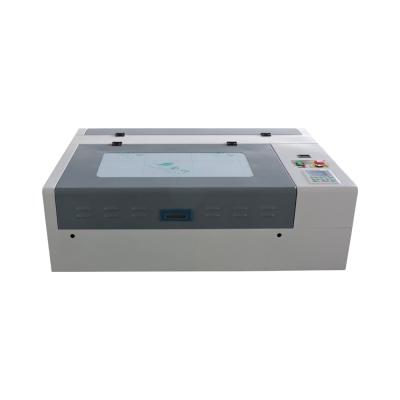 China Laser Engraving Mini 4060 Die Board and Laser Cutting Machine 40w 50w 60w Laser Engraving Machine for sale