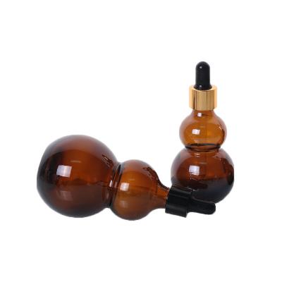 China Cosmetic in Stock Low MOQ 5ml 10ml 15ml 20ml 30ml Empty Amber Gourd Glass Dropper Bottle for Oil Liquid Medicine for sale