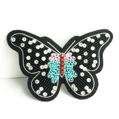 China Sustainable Custom Leather 3D Black Butterfly Transfers Cloth Apparel Patches Wholesale Woven Patches for sale