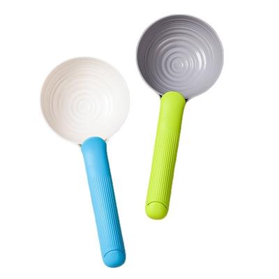 China ABS Pet Supplies Dog Food Scoop Two Color Round Pet Food Spoon Dual Function Cat Food Spoon for sale