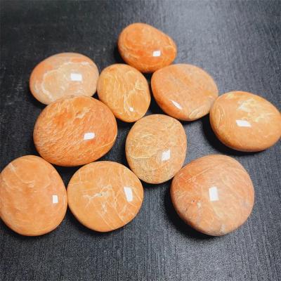 China China Natural healing yellow moonstone palmstone crystal reiki orange moon stone palm for decoration for sale