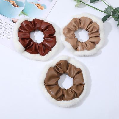 China Fuzzy Fur Hair Scrunchies Pu Ponytail Holder Vintage Elegant Hot Edge Korean Fancy Link Hair Band Autumn Hair Accessories for sale