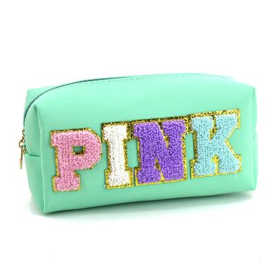 China Durable Wholesale Multi Colors Waterproof Nylon Pouch Cosmetic Bag Women Letters Pink Makeup Bag Teens Large Toiletry Bag for sale