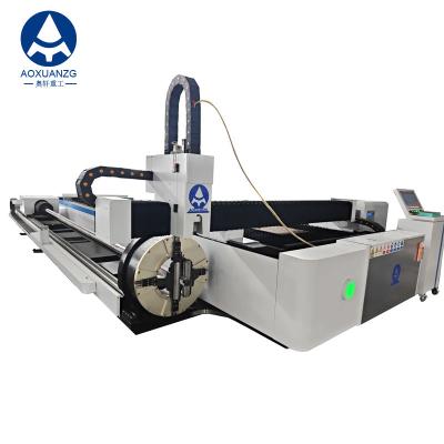 China Open Type 3015 Three Chuck Tube And Plate Fiber Laser Cutting Machine 3000w CNC Laser Cutter With Exchange Platform for sale