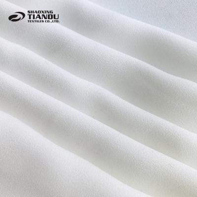 China 100% Sustainable Tear-Resistant Recycled Plastic Fabric 75D Polyester Foam Crepe For Fashion Dress for sale