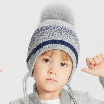 China Two Styles Winter Poms Wholesale Kids Boys Knitted Wool Beanie With Fur Pompom Toddler Ear Flap Custom Warm Ski Hat for sale