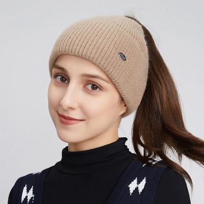 China COMMON Women Girls Knit Beanie Hat High Messy Bun USA Amazon Style Wool Ponytail Beanie Hat Logo Custom Knitted Hats With Hole for sale