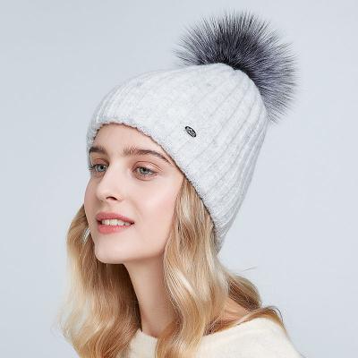 China Factory JOINT Women Knit Hats With Real Wool Fur Pompom Winter Mohair Knitted Hat Strips Pattern Ski Hat Double Layer for sale