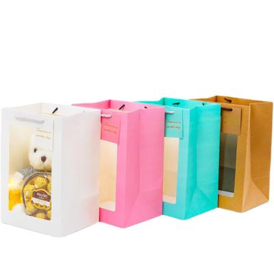 China Creative Wholesale Recyclable Flower Paper Bag Bouquet Waterproof Handbag With Clear PVC Window for sale