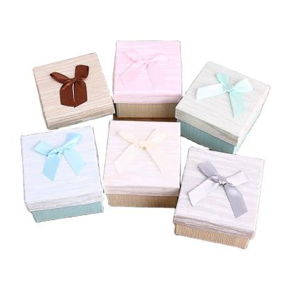 China Biodegradable Creative Wooden Exquisite Bow Jewelry Box Grain Stain Packaging Boxes for sale