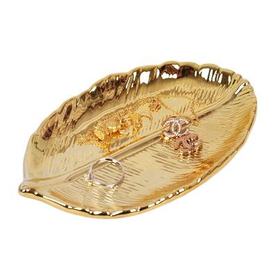 China Tary Modern Ceramic Metal Leaf Gold Dish Jewelry Decorative Stocked Tray for sale