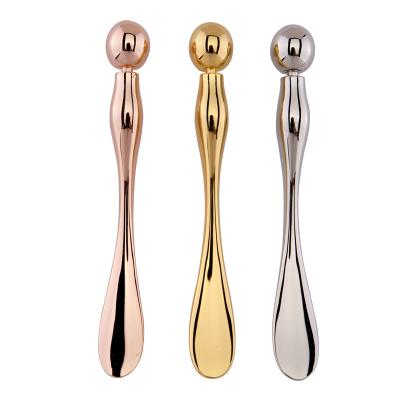 China New Arrival Golden Eye Massager Roller Cream Spoon Cosmetic Eye Massager Spatula Eye Cream Bar for sale