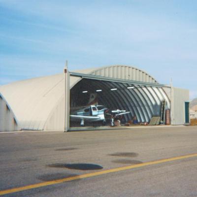 China Steel Fabricated House Prefab Steel Frame Aircraft Hangar With High Quality Sliding Door for sale