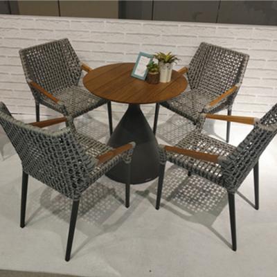 China Weather Outdoor Furniture Synthetic Grass Garden Table Belt Weaving 4 Outdoor Chairs 1table Set Modern Outdoor Furniture for sale