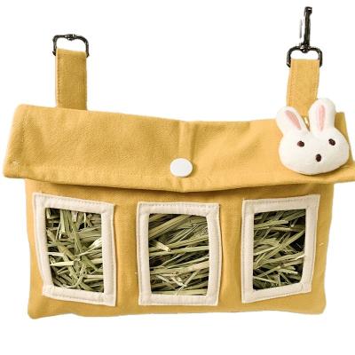 China Small Rabbit Hanging Wholesale Automatic Hay Feeder Bag Yellow Animal Goods for sale