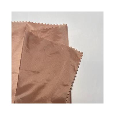 China New production water resistant 0.08 ripstop fabric woven fabric nylon taffeta for garment and down jacket for sale